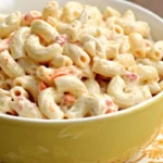 Creamy Hawaiian Macaroni Salad recipe in a yellow bowl.